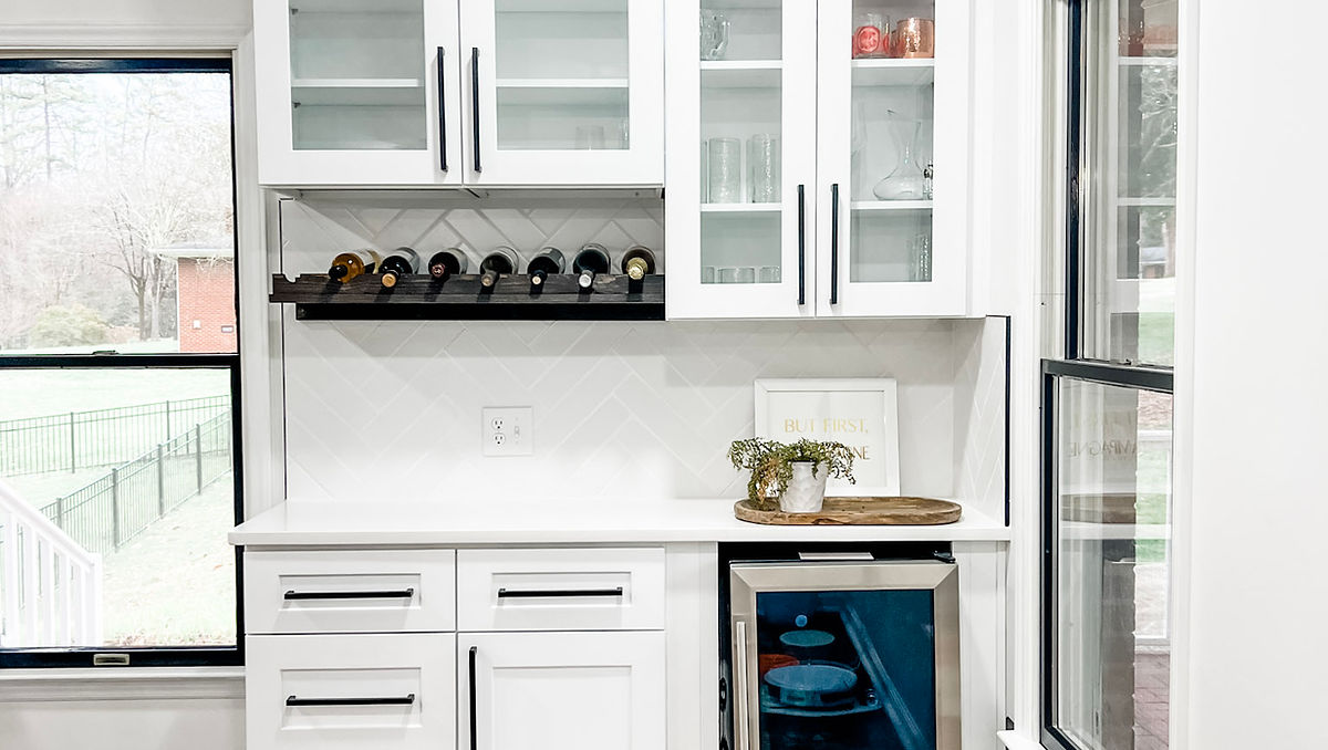 home renovation near Huntersville, NC featuring a bright white kitchen renovation with wine cooler built in.