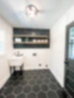 home remodel near Huntersville NC with black and white mudroom/laundry room