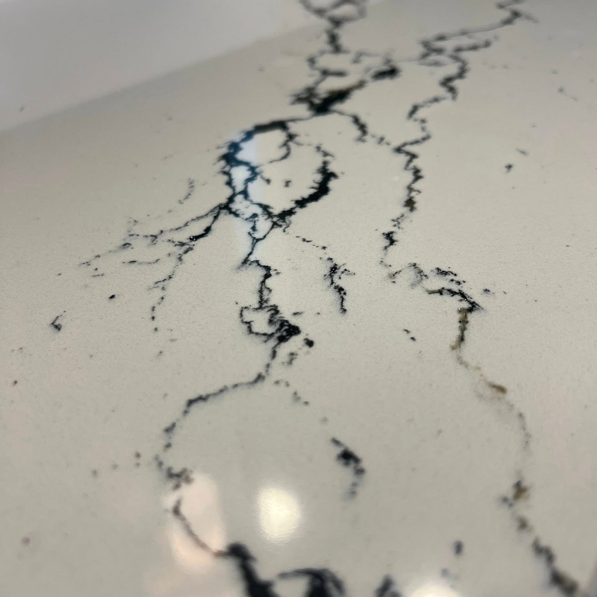 close up on white countertop with black veining