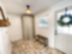laundry room with a natural wreath on the back door