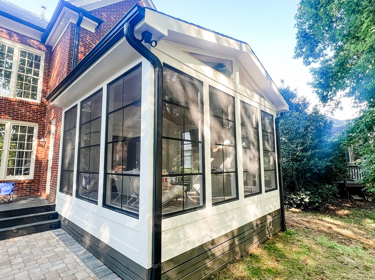 exterior home renovation near Cornelius, NC featuring a new all season porch attached to a brick paver patio.