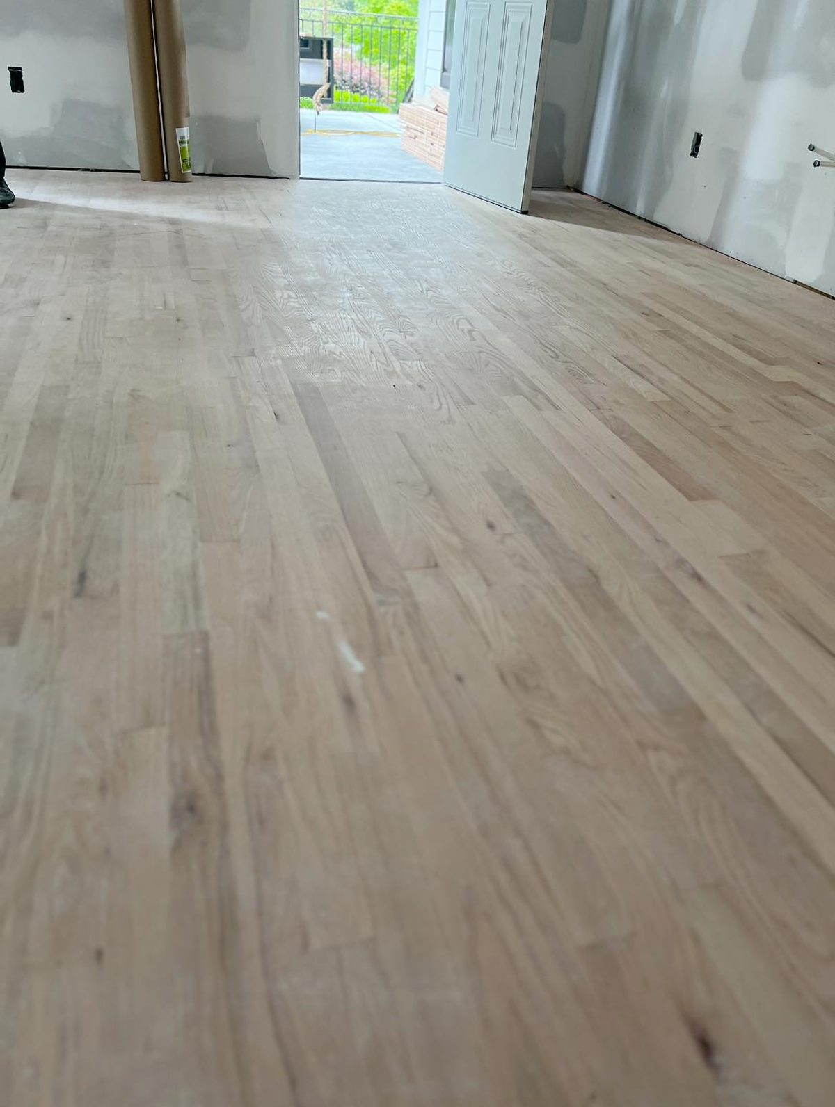 garage conversion in progress on home remodel near Cornelius NC. Hardwood floors being sanded in this photo.