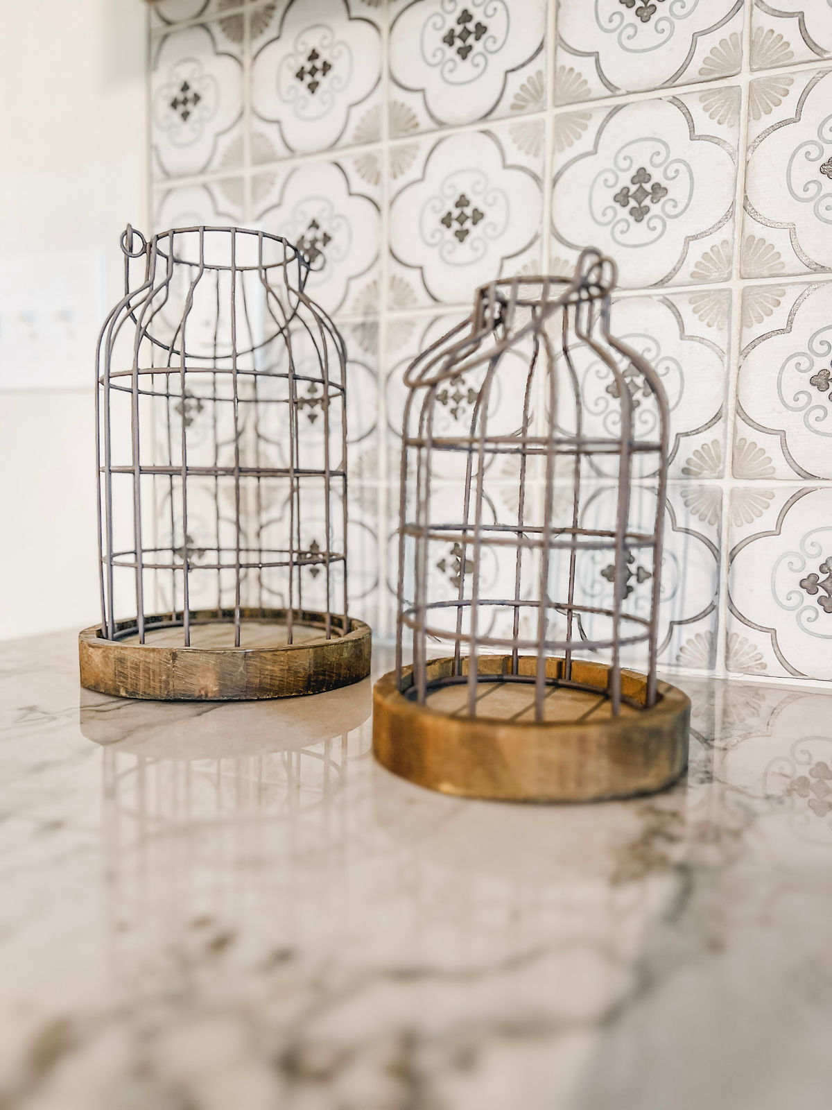 decorative farmhouse candle holders on the counter in a renovated kitchen