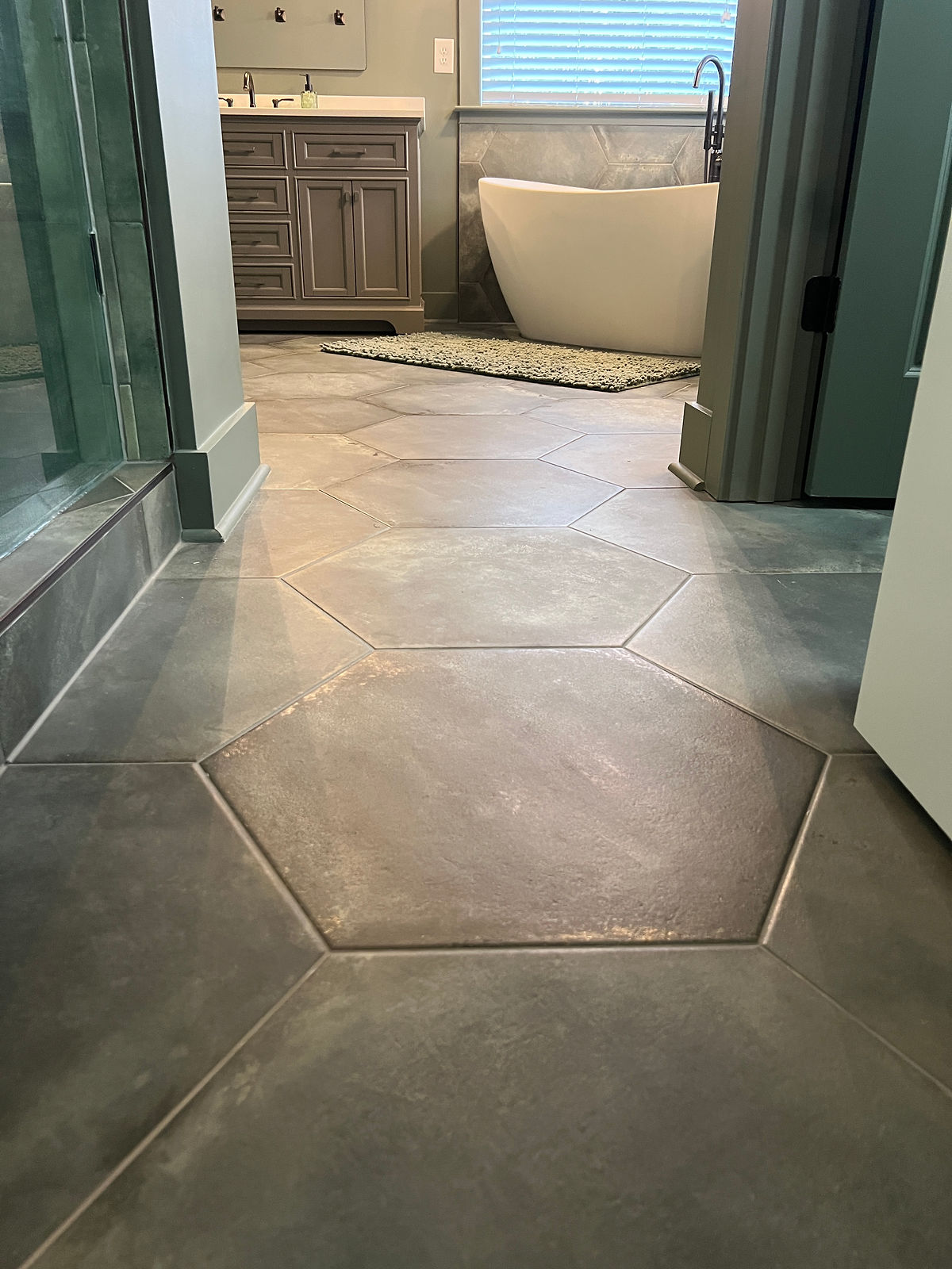 dark matte tile hex tile flooring in a bathroom home renovation near Davidson, NC