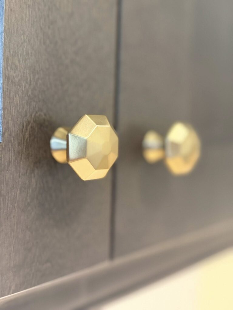 close up shot of brass cabinet pulls in a kitchen renovation near Davidson, NC.