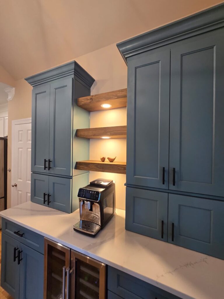 blue cabinetry surrounds a coffee bar and open shelving in this kitchen renovation near Cornelius, NC.