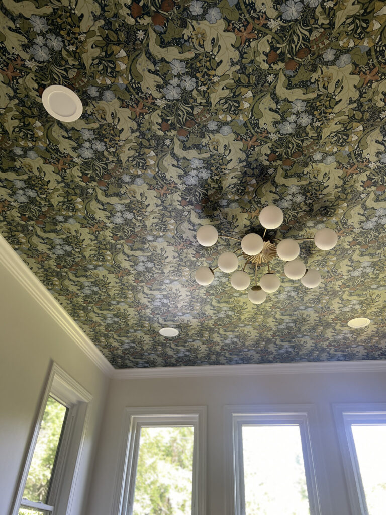 home renovation Davidson, NC featuring botanical wall papered ceiling in a dining room.